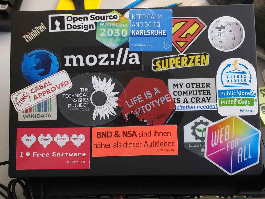 Colorful, overlapping stickers on a laptop